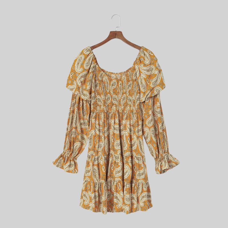 Side view of the Anna Boho Paisley Mini Dress in yellow, showcasing the dress’s silhouette