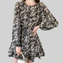 Back view of Anna Floral Long-Sleeve Mini Dress in black, highlighting the back and sleeve details