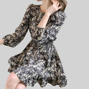 Front view of Anna Floral Long-Sleeve Mini Dress in black, showing the overall fit and floral design