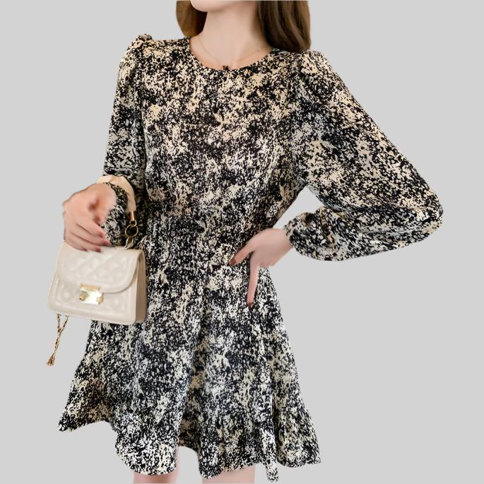 Side view of the Anna Floral Long-Sleeve Mini Dress in black, displaying the long sleeves and silhouette